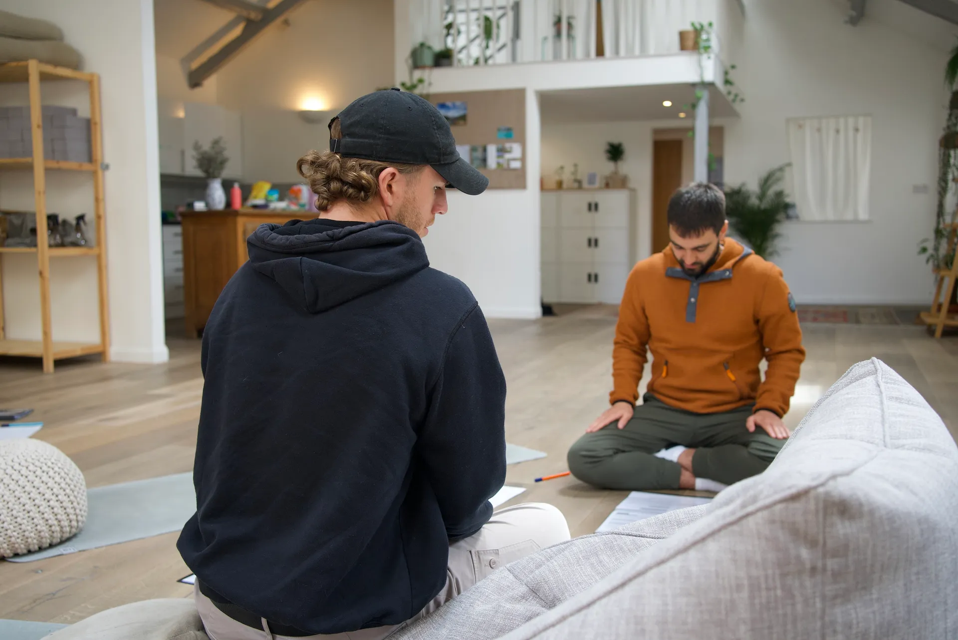 A facilitator holding space in a circle