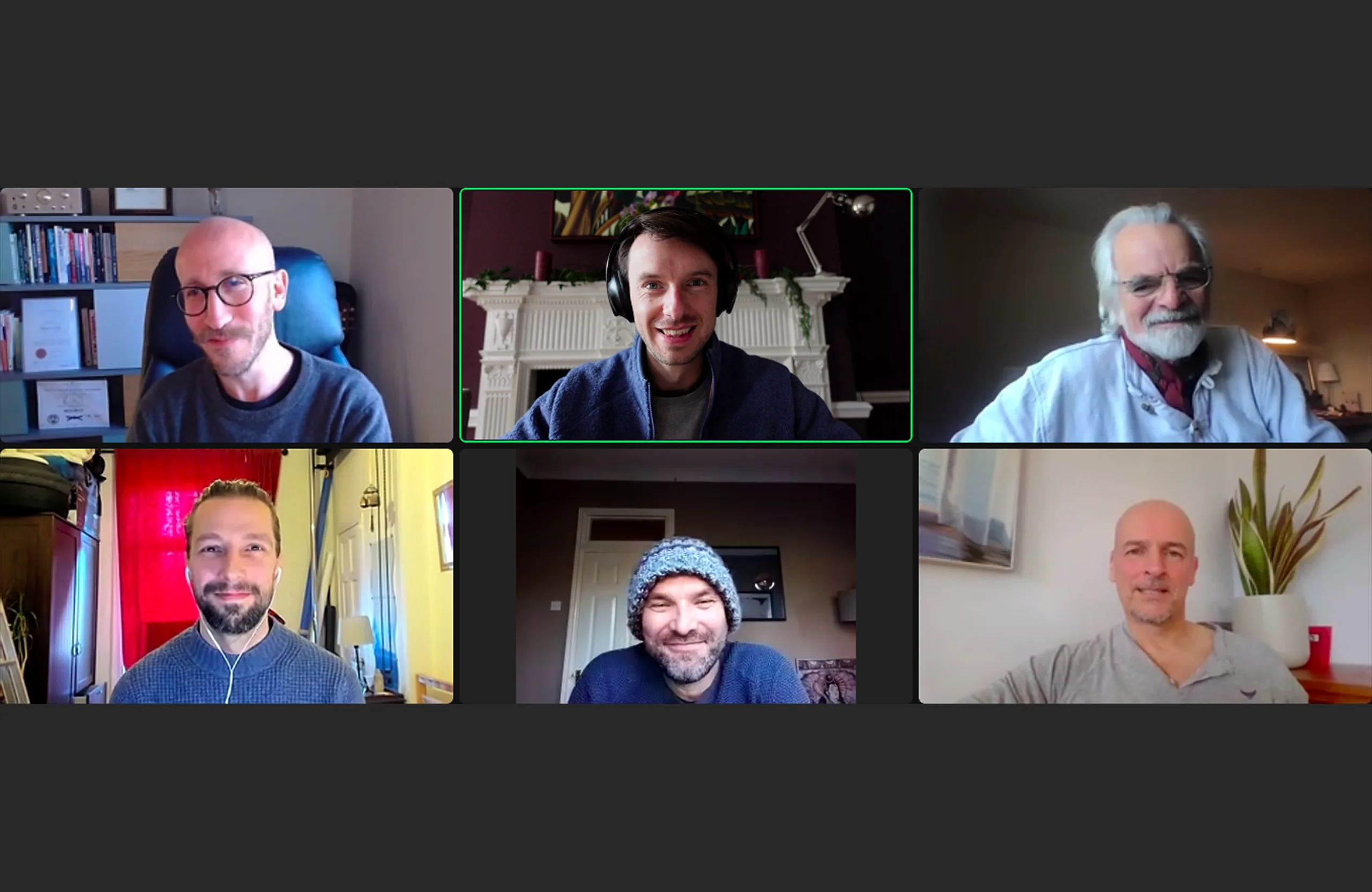 A men's circle in session over video call: six men on screen, one in the active speaker frame.